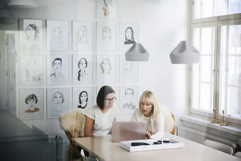 Two people working in office.