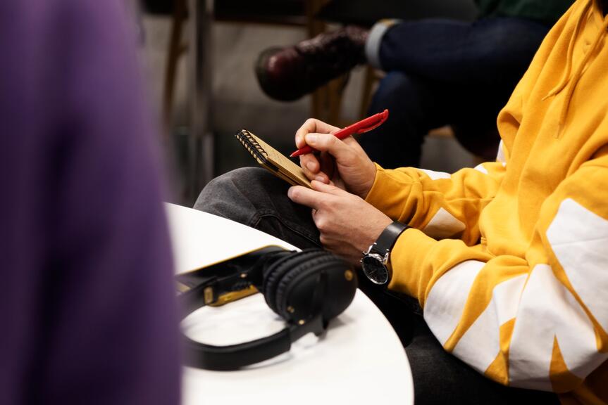 A person is writing notes