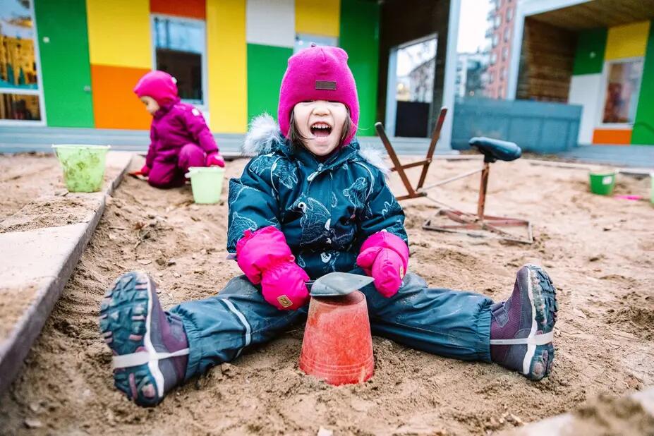 A child playing in a sandpit